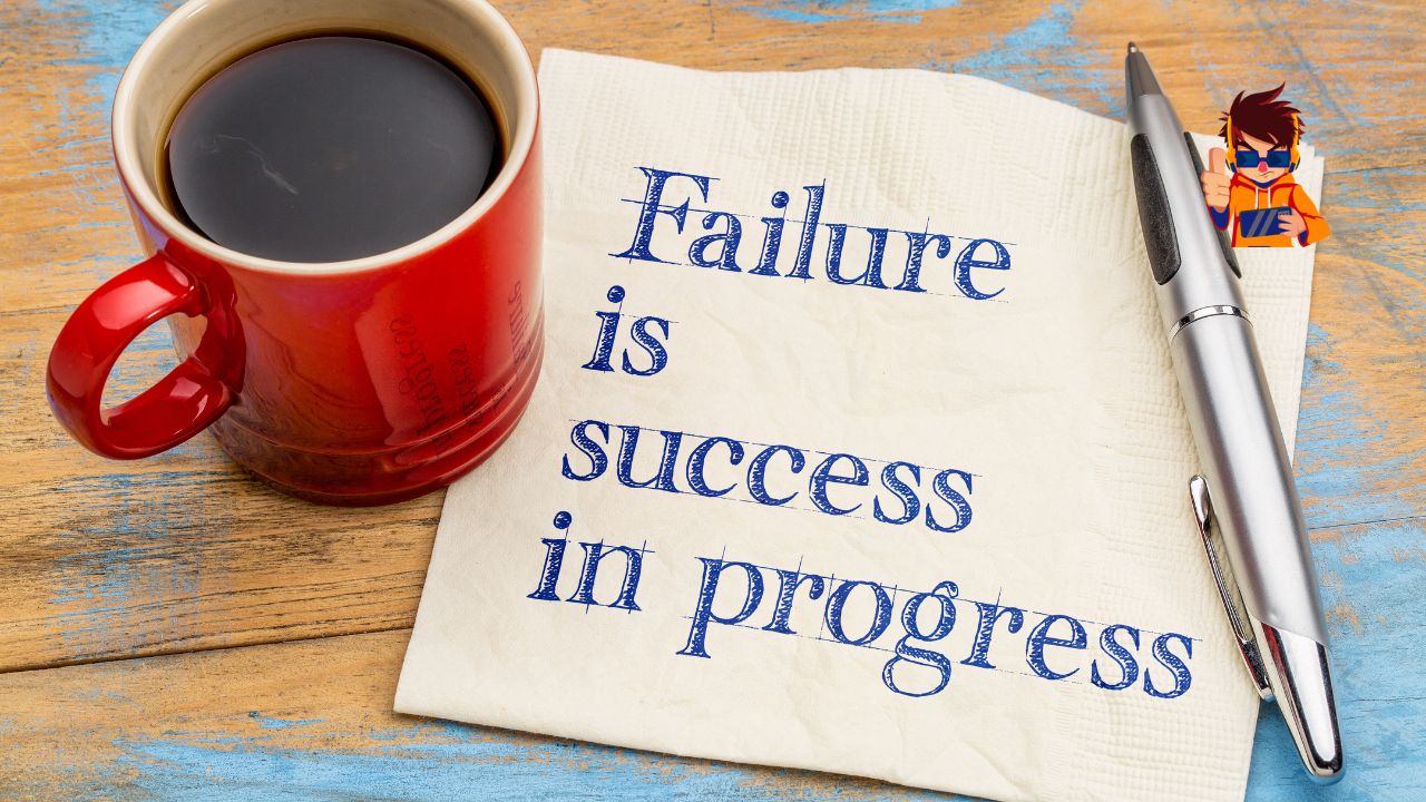 Lessons from Famous Failures Turning Setbacks into Success A red coffee cup, a silver pen, and a napkin with the handwritten quote 'Failure is success in progress' placed on a rustic wooden table. The image symbolizes resilience, learning from setbacks, and turning failures into opportunities for success.