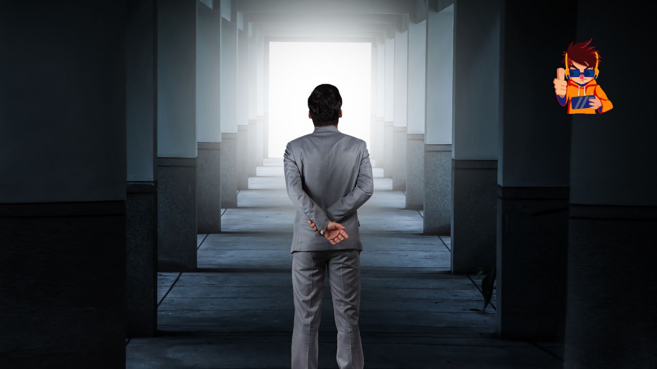 How Challenges Shape You Into a Better Leader A man in a suit stands with his back to the viewer, facing a long corridor with light shining at the end. The image symbolizes growth, reflection, and the journey through challenges toward leadership and success.