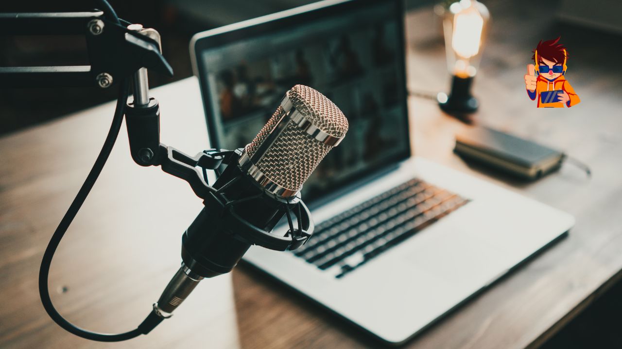 Podcasts vs. Video — Where Does Engagement Really Live Close-up of a podcast microphone in front of an open laptop on a wooden desk, with a warm ambient light in the background.